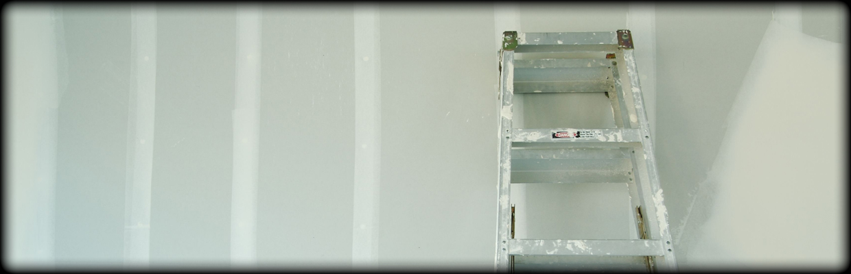 Ladder leaning against drywall
